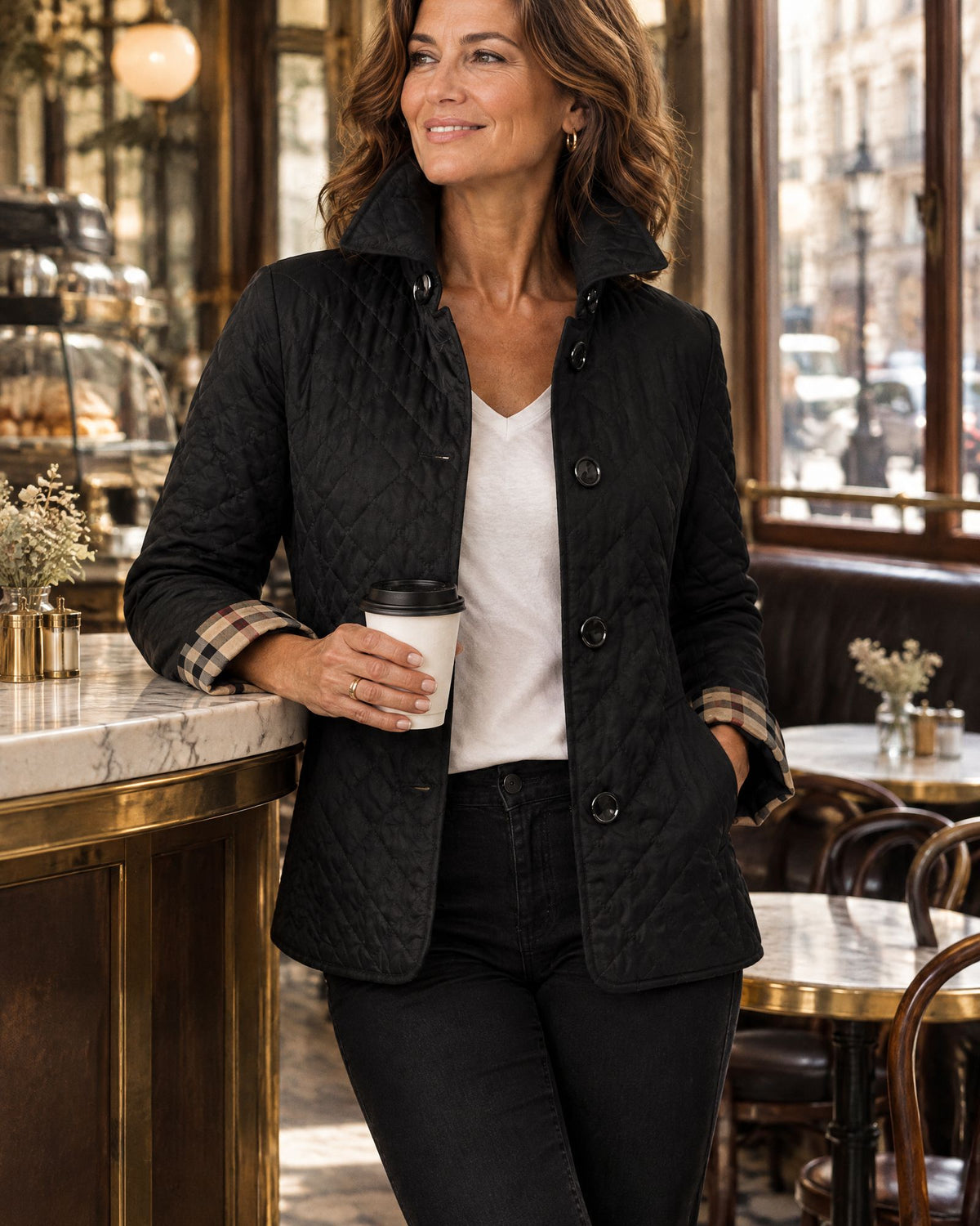 The black quilted jacket in a London cafe