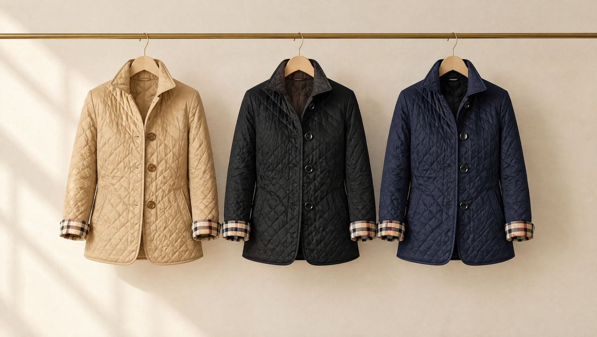 Camel, black and navy quilted jackets on a rail
